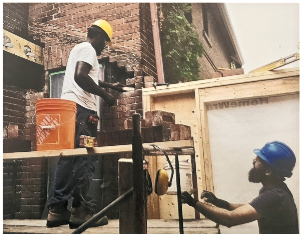 Garvin Louisy completing brick masonry work on site