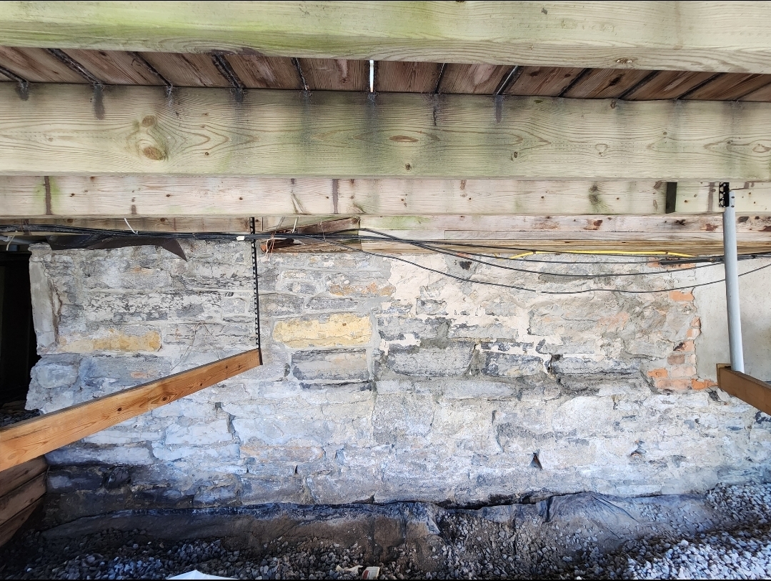 Historic stone foundation before repointing
