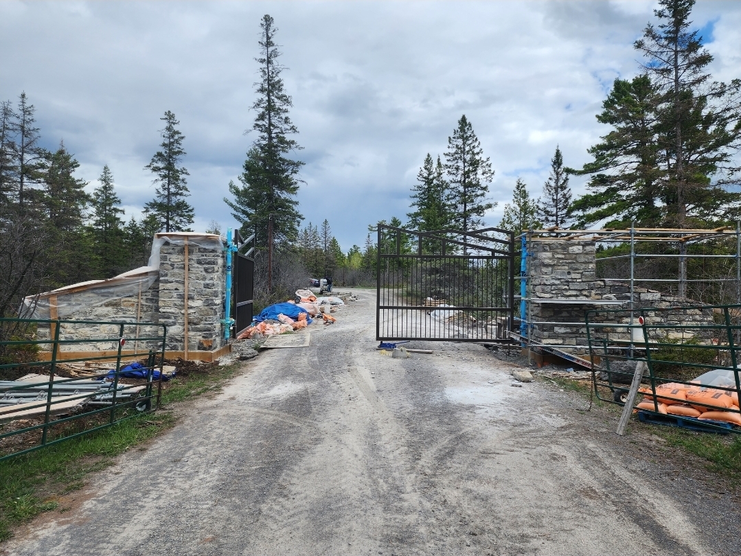 Stone entrance walls under construction